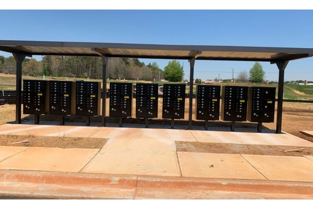 Community mailboxes under a structure for weather.